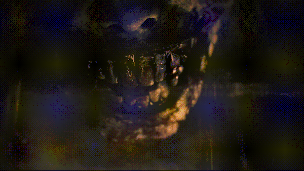 A GIF displaying a zombified mouth which then progresses to the title "Resident Evil: Requiem" in which the 'q' of "Requiem" flickers between a q and a 9.